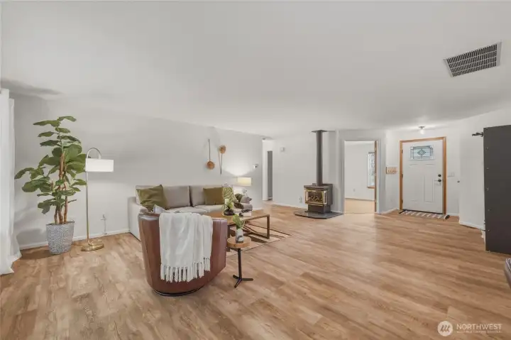 Living room looking to hall and one of two secondary bedrooms.