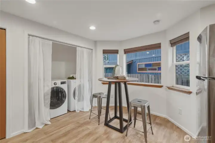 Laundry with extra storage space off kitchen.  Door on left leads to two car garage.