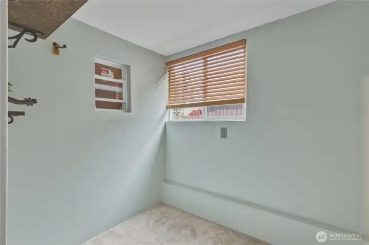 Non-permitted office in garage.  Leave in for additional living space or remove.  Still plenty of room to park a car and storage space in two car garage.