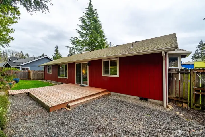 Plenty of room to entertain on back deck.  Perimeter drainage was redone by this owner. Nice and dry back yard.