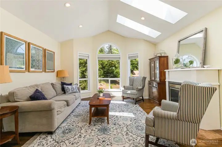 Living room upstairs with skylights and windows bringing in natural light. Living room upstairs with skylights and windows bringing in natural light.