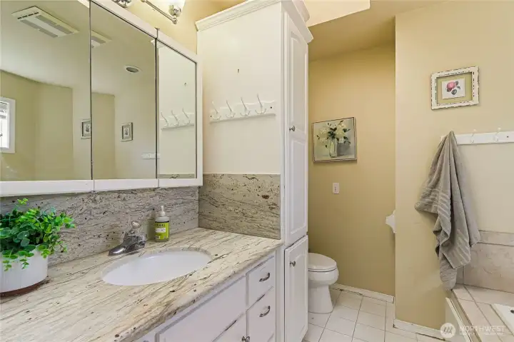 Primary bathroom with granite counter top Primary bathroom with granite counter top