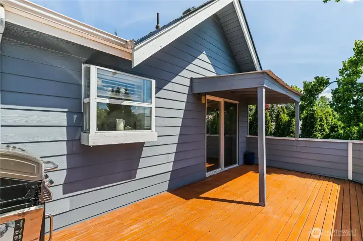Upstairs deck with partially covered area. Upstairs deck with partially covered area.