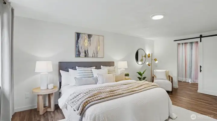 Luxurious primary suite complete with ample walk-in closet and private access to the relaxing hot tub and entertainment-sized deck.