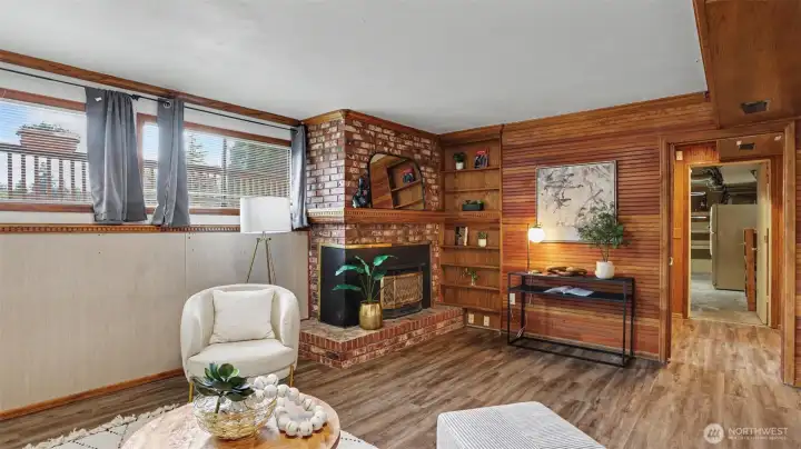 Family room in the daylight basement with an additional fireplace for extra comfort.