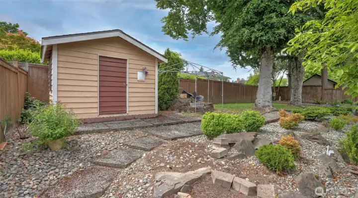 Convenient backyard garden shed for extra storage.