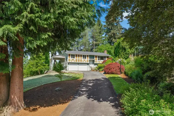 Split level set back from street on half acre lot with established landscaping.