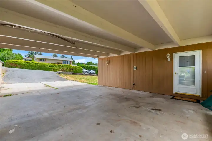 Inside carport looking toward front door