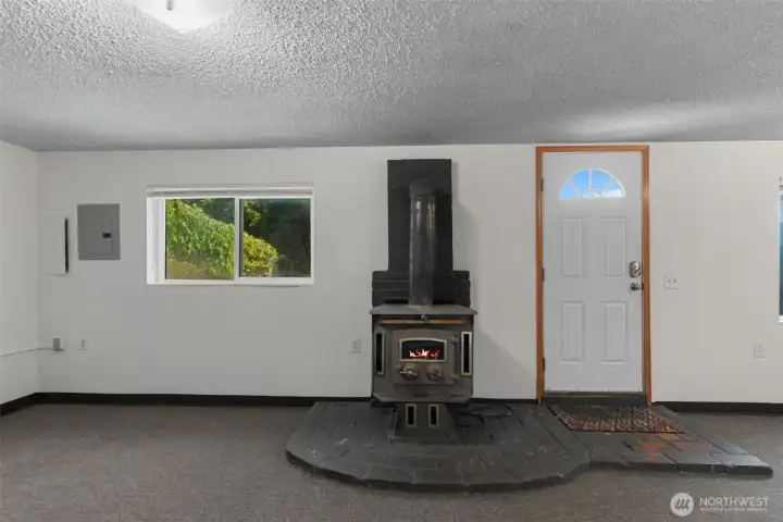 Basement with wood stove and exterior access