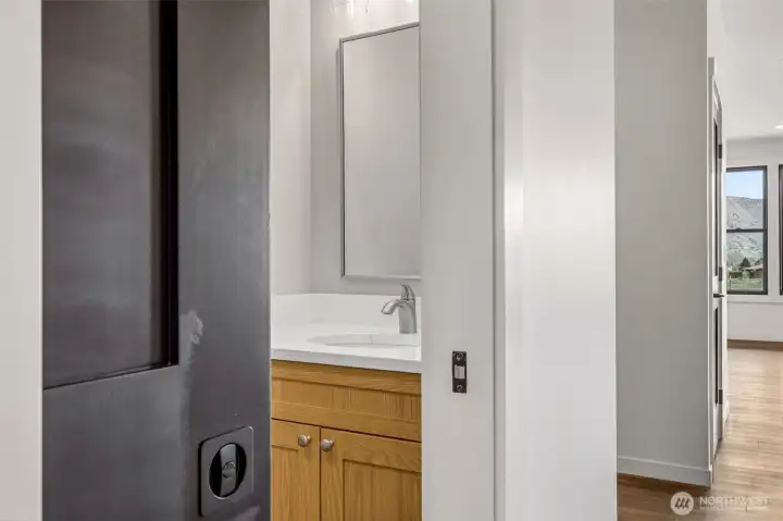 Powder room with sink and toilet- great for hosting!