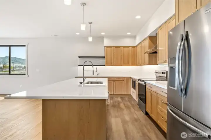 Chef's kitchen ready for hosting and daily living.