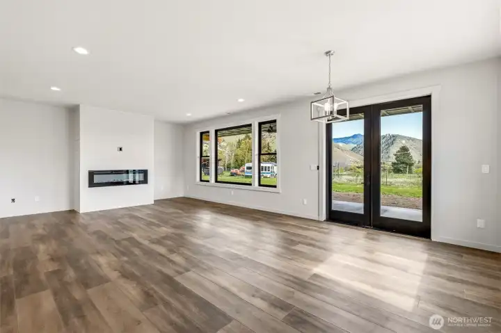 Electric fireplace framed in white wood accent.