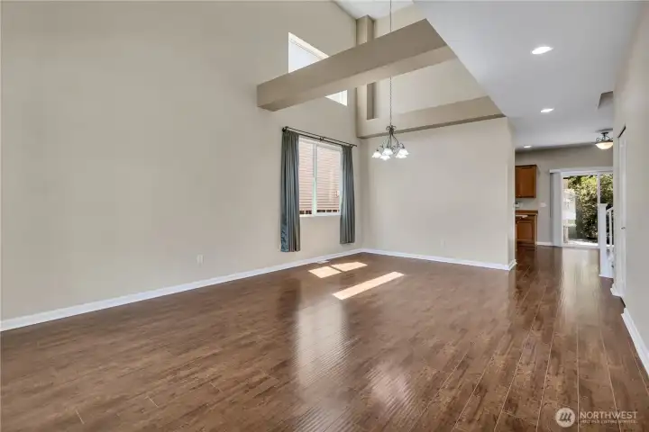 Step right into the open living and dining room. High vaulted ceilings with large windows let in the light. Open beams were painted to give it architectural interest. Step right into the open living and dining room. High vaulted ceilings with large windows let in the light. Open beams were painted to give it architectural interest.