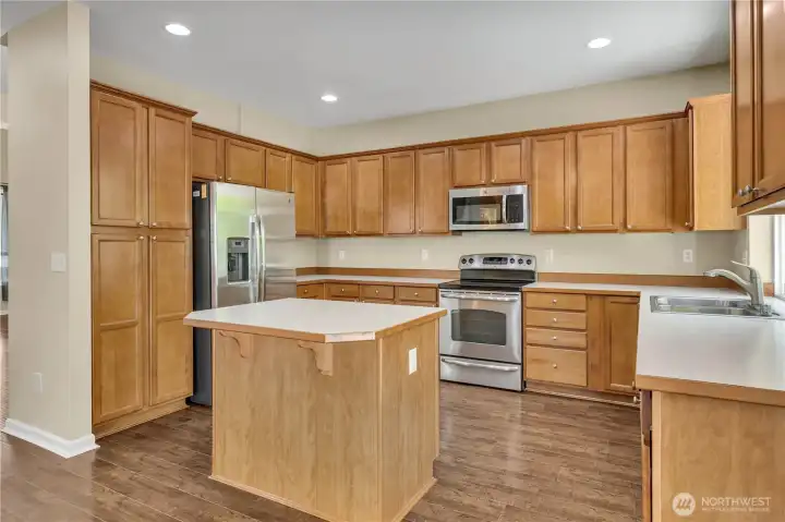 Eat-in island with storage underneath for large items. Upright pantry cabinets. Eat-in island with storage underneath for large items. Upright pantry cabinets.