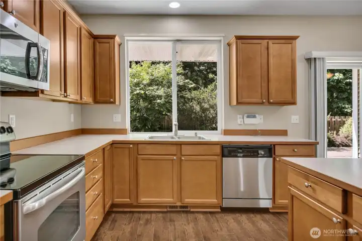 Kitchen overlooks the tranquil backyard. Kitchen overlooks the tranquil backyard.