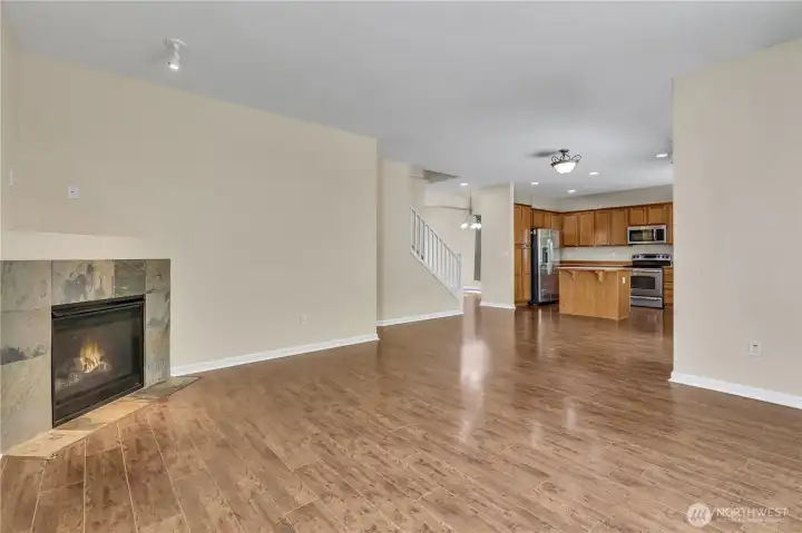 Low maintenance laminate flooring throughout the main floor. Garage access and half bathroom behind fireplace wall. Low maintenance laminate flooring throughout the main floor. Garage access and half bathroom behind fireplace wall.
