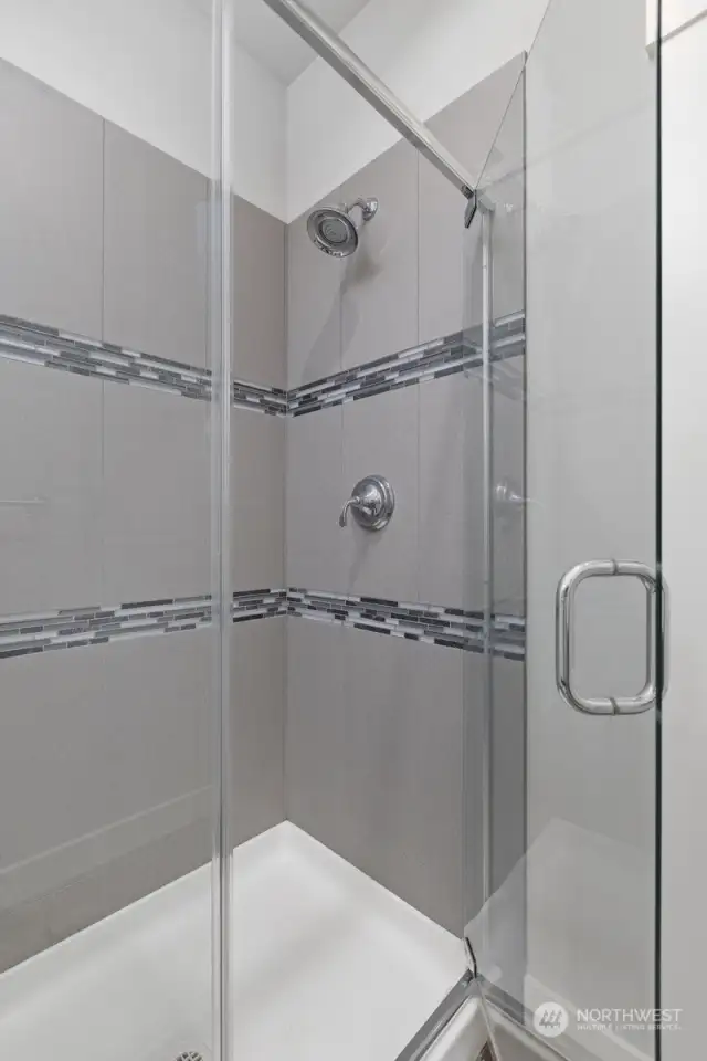 This shower has gorgeous tile work and is nicely sized.