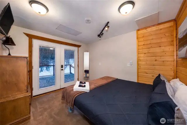 Upstairs bedroom with French doors leading to the quiet back deck.