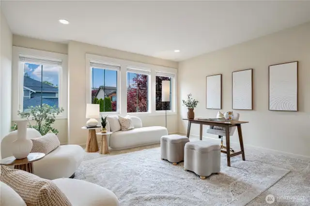 Flexible bonus room, bathed in natural light, with a large west-facing window that fills the space with warmth and brightness. Perfect as a 5th bedroom, office, or additional living space