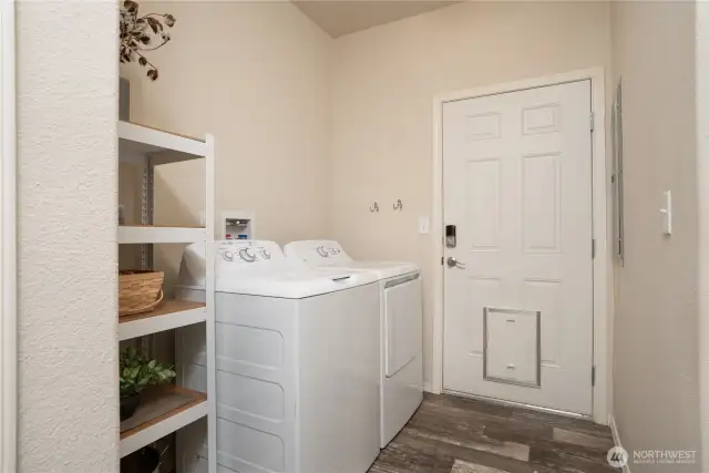 Another view of utility room, with access to backyard.