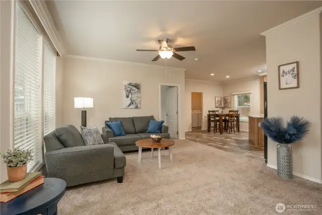 As you enter this welcoming home, you will notice the nice open concept with the living room flowing into the kitchen. Door in center of photo leads to the primary en suite!