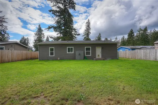 Lots of room to roam in this large fenced backyard.