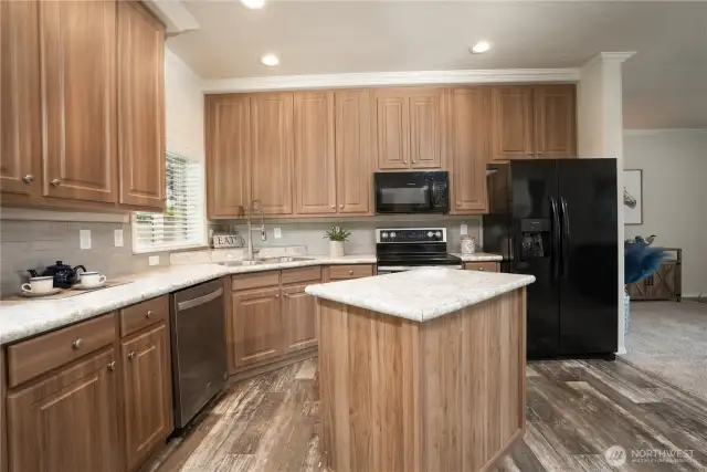 Great kitchen with lots of cabinets, island and ample counter space!
