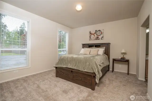 The primary en suite, the bedroom is spacious with plenty of room for your larger furniture and on the right is the doorway to the 3/4 bathroom.