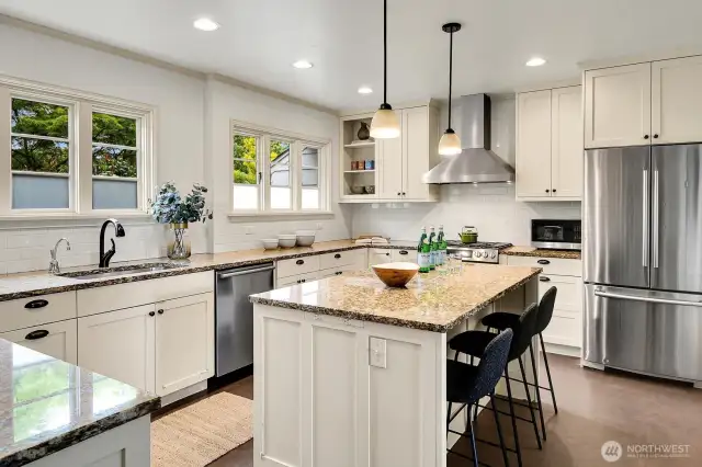 Expansive eat-in kitchen equipped with new appliances.