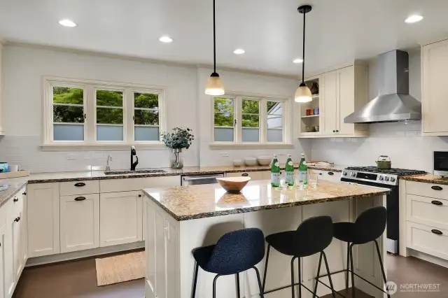 Expansive eat-in kitchen equipped with new appliances.