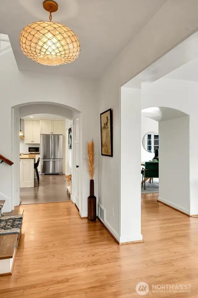 Graceful entry with beautiful hardwoods and stunning, artistic fixtures.
