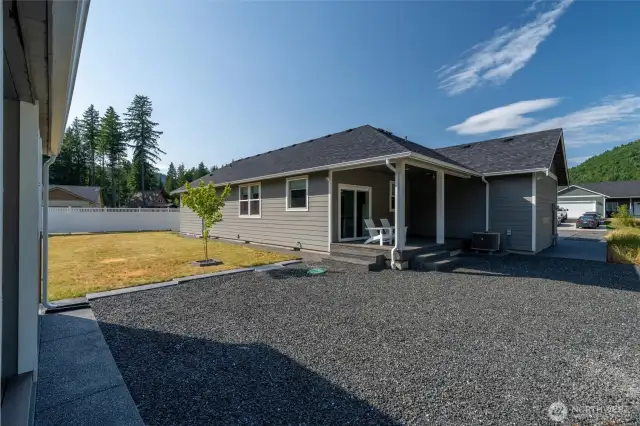 View of the back yard and covered back patio.