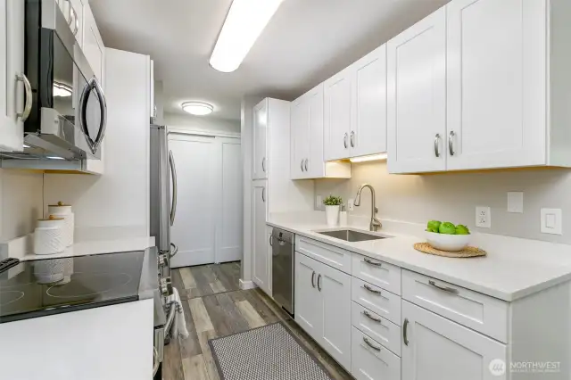 Quartz counter tops, Bosh dishwasher and garbage disposal.