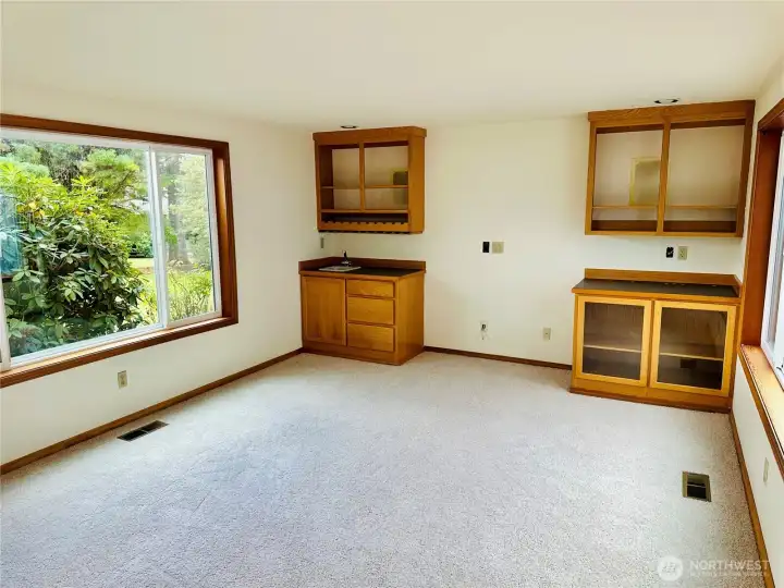 Large den with new carpet.