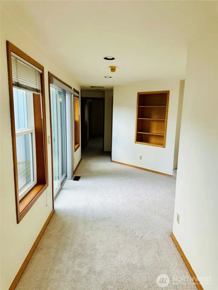 Hallway to downstairs bedroom, garage and bathroom.