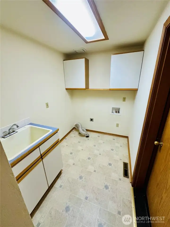 Laundry room with utility sink.