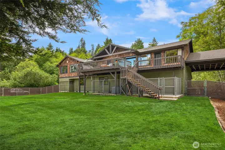 The back yard is fully fenced with a separate dog run under the deck.