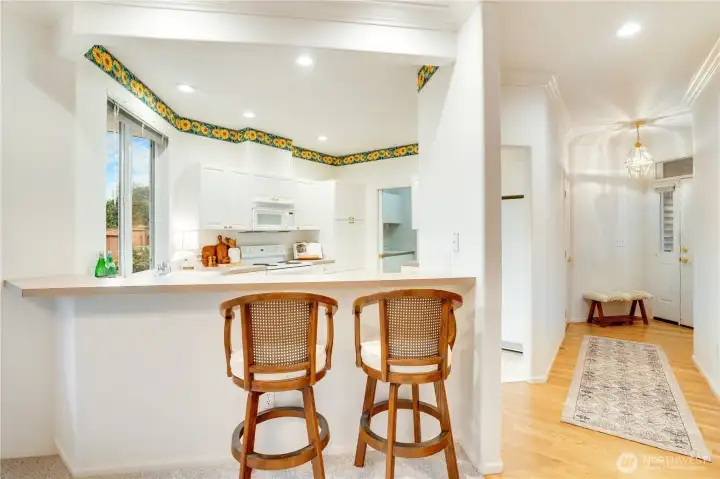 Kitchen is open to the living and dining room. The bar seating provides great fluidity and function.