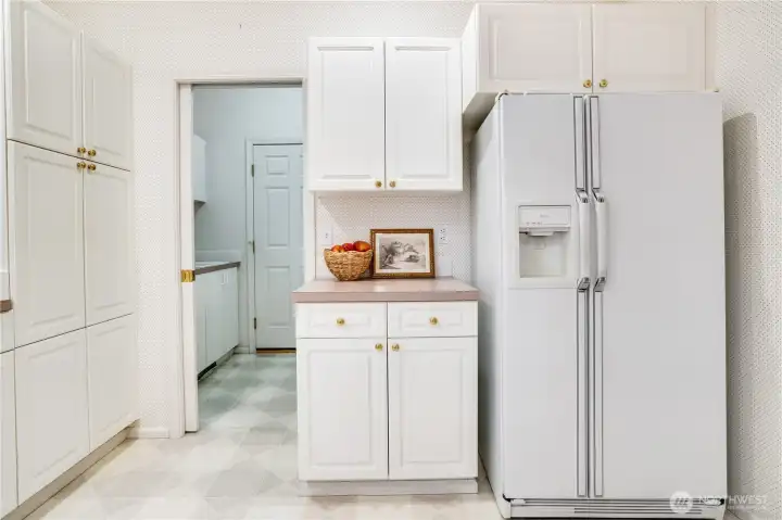 Laundry room is attached to kitchen and opens to the garage.