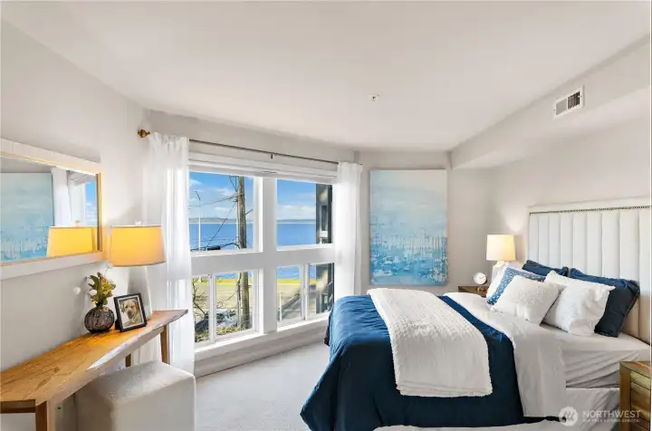 Primary bedroom with new lower windows, new carpet and new paint.