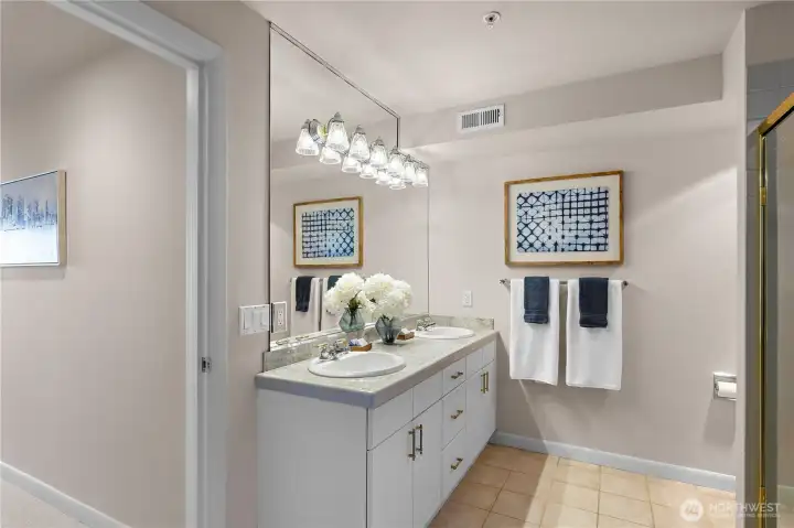 The primary bathroom includes a dual sink vanity.