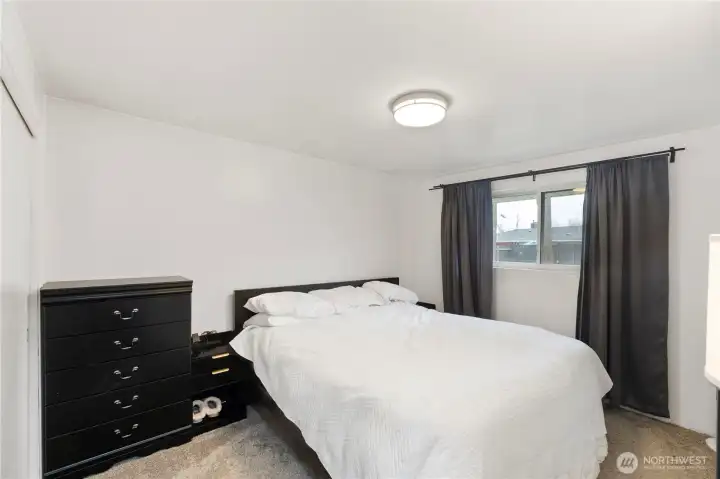 Large primary bedroom adjacent to bath.