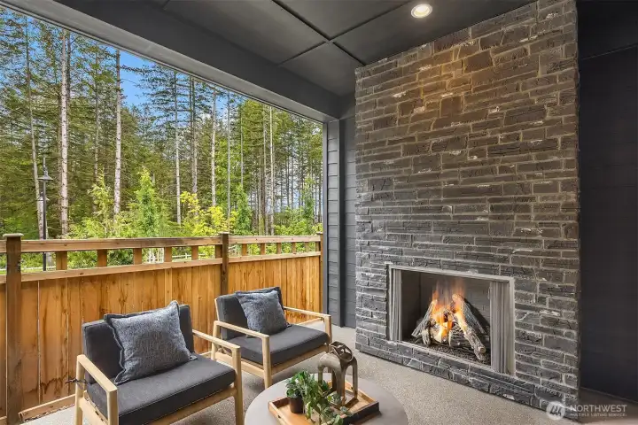 Covered patio with exterior fireplace