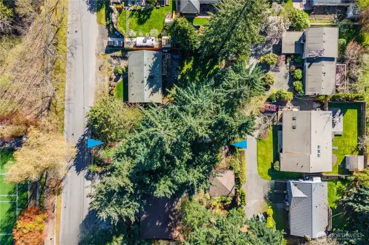 This bird's eye view shows the access on the north and south sides of the property, and surrounding homes.