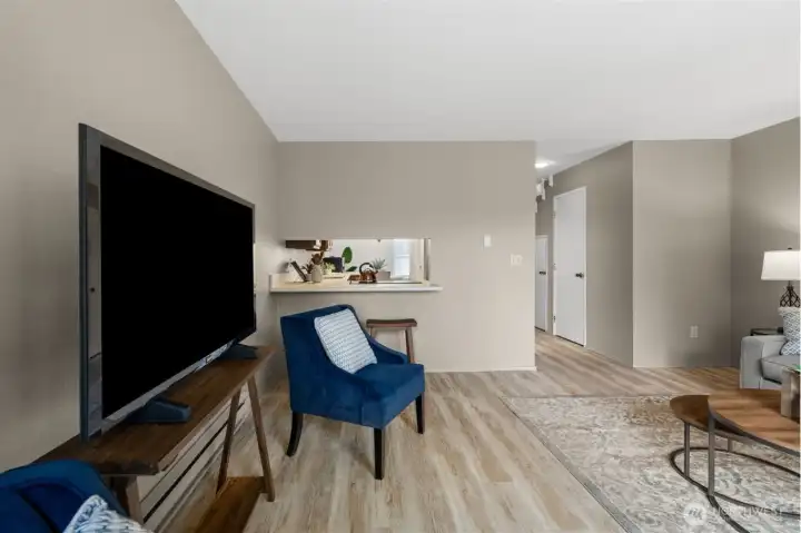 Back inside, you can see right into the kitchen, which helps the whole space feel connected and easy to live in. It is a layout that feels both practical and inviting.