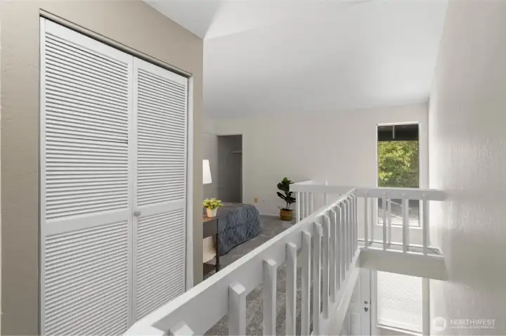 Upstairs, you’ll find the first loft-style bedroom. All of the condos in this community were designed with an open second bedroom, which gives the space a light, airy feel and a little extra flexibility.