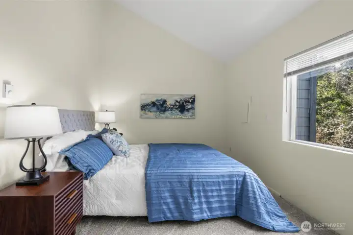 The vaulted ceilings lift the whole room and give the bedroom a more spacious, elevated feel.