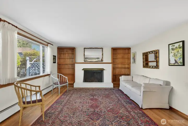 Nice sized Living room with shelves and wood burning FP.