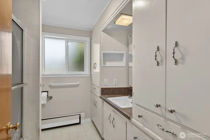 Full bath #1 is generous in size with lots of built ins for ample storage.