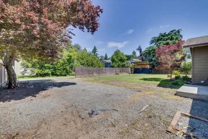 Ample parking and partially fenced backyard access.